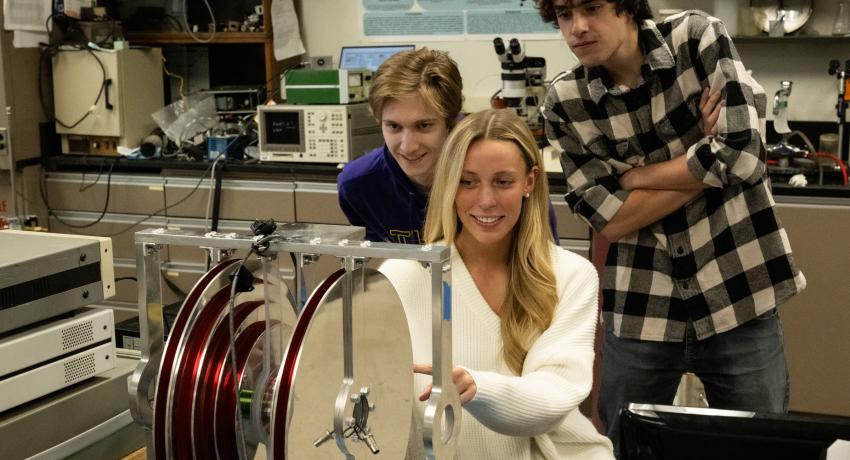 Three students working n a lab