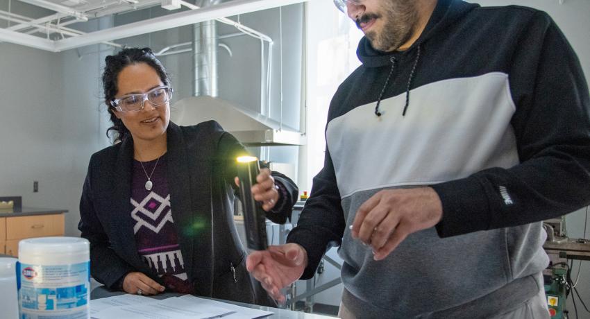 A young man and a young woman working together in a Penn State lab